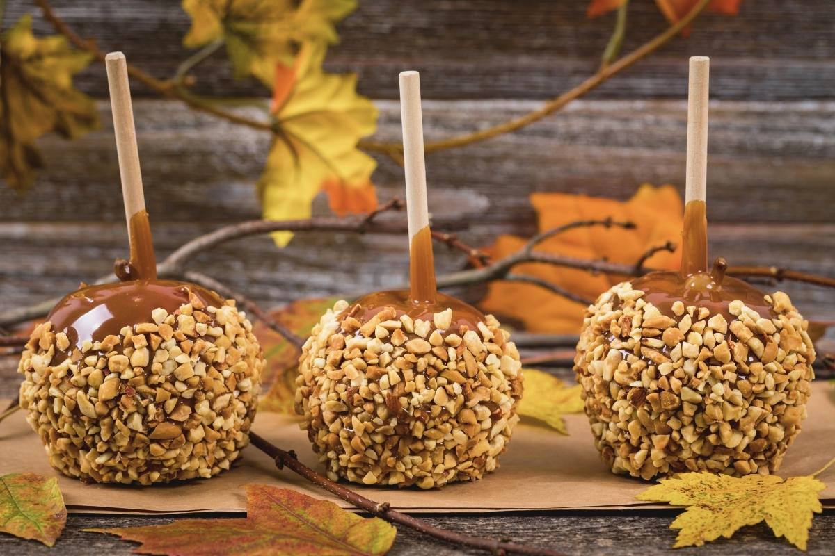 caramel apples under a fall leaves background